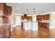 Gourmet kitchen featuring wood cabinets, central island, and hardwood floors at 2602 Alcovy Club Dr, Dacula, GA 30019