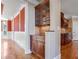 A butler's pantry with wood cabinets, granite countertops, and tile backsplash at 2602 Alcovy Club Dr, Dacula, GA 30019