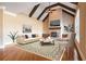 The living room has wood floors, a fireplace, and a vaulted ceiling at 2602 Alcovy Club Dr, Dacula, GA 30019