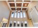 Living room showcasing tall windows, coffered ceiling, and natural light at 2602 Alcovy Club Dr, Dacula, GA 30019