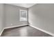 Simple bedroom with hardwood floors and neutral walls at 2925 Fern Valley Sw Dr, Marietta, GA 30008