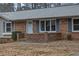 Brick front porch with gray roof and blue shutters at 2925 Fern Valley Sw Dr, Marietta, GA 30008