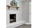 White brick fireplace with wood mantel and hearth at 2925 Fern Valley Sw Dr, Marietta, GA 30008