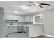 Renovated kitchen with light green cabinets and stainless steel appliances at 2925 Fern Valley Sw Dr, Marietta, GA 30008