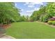 Expansive backyard featuring lush greenery, mature trees, and a charming gazebo at 3901 Old Atlanta Station Se Dr, Atlanta, GA 30339