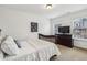 This bedroom features carpeted floors, two windows, and a mounted tv at 3901 Old Atlanta Station Se Dr, Atlanta, GA 30339