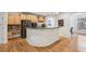 Kitchen with hardwood floors, granite countertops, and open floor plan at 3901 Old Atlanta Station Se Dr, Atlanta, GA 30339