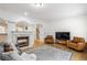 Bright living room with fireplace, hardwood floors, and archways to an adjoining room at 3901 Old Atlanta Station Se Dr, Atlanta, GA 30339