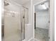 Walk-in shower with bench in updated bathroom, adjacent to the walk-in closet at 3901 Old Atlanta Station Se Dr, Atlanta, GA 30339