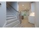 Bright, neutral staircase leading to an open-concept living area with hardwood floors and modern finishes at 504 Winston Croft Cir # 54, Johns Creek, GA 30022