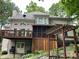 House exterior showcasing a deck, screened porch, and pergola at 5412 Wild Flower Ct, Powder Springs, GA 30127