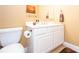 Clean bathroom with white vanity, toilet and tasteful decor at 5412 Wild Flower Ct, Powder Springs, GA 30127