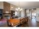 Spacious dining area with a large wooden table and chairs, adjacent to the kitchen at 5412 Wild Flower Ct, Powder Springs, GA 30127