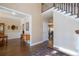 Two story foyer with hardwood floors and views to dining room at 5412 Wild Flower Ct, Powder Springs, GA 30127