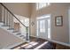 Bright and spacious entryway with hardwood floors and staircase at 5412 Wild Flower Ct, Powder Springs, GA 30127