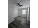 Cozy bedroom with ceiling fan and vinyl plank flooring at 6658 Collins Ct, Riverdale, GA 30274