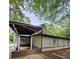 Side view of house with carport and landscaping at 6658 Collins Ct, Riverdale, GA 30274