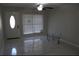 Spacious living room with tile flooring and large windows at 6658 Collins Ct, Riverdale, GA 30274