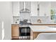 Stainless steel appliances and light oak cabinets highlight this modern kitchen at 1573 Newton Se Ave, Atlanta, GA 30316