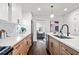 Modern kitchen with stainless steel appliances and light wood cabinets at 1573 Newton Se Ave, Atlanta, GA 30316