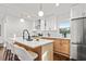 Modern kitchen with large island, quartz countertops and stainless steel appliances at 1573 Newton Se Ave, Atlanta, GA 30316