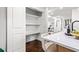 White pantry with ample shelving for storage at 1573 Newton Se Ave, Atlanta, GA 30316