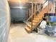 Basement with ping pong table and unfinished stairs at 3581 Drum Roll Ln, Snellville, GA 30039