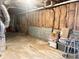 Unfinished basement with exposed walls and storage items at 3581 Drum Roll Ln, Snellville, GA 30039