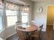 Kitchen nook with a round wooden table and four chairs at 3581 Drum Roll Ln, Snellville, GA 30039