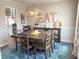 Dining room with a farmhouse table and chandelier at 3581 Drum Roll Ln, Snellville, GA 30039