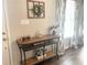 Entryway with console table, window, and decorative items at 3581 Drum Roll Ln, Snellville, GA 30039