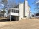 House exterior showcasing a screened porch and backyard at 3581 Drum Roll Ln, Snellville, GA 30039