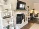 Stone fireplace with a mantel and built-in shelving at 3581 Drum Roll Ln, Snellville, GA 30039