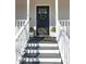 Inviting front door entry with a wreath and white planter boxes at 3581 Drum Roll Ln, Snellville, GA 30039