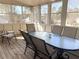 Relaxing screened porch with a glass-top table and chairs at 3581 Drum Roll Ln, Snellville, GA 30039