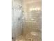 Large walk-in shower with glass enclosure and tiled walls at 3581 Drum Roll Ln, Snellville, GA 30039