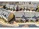 Community of townhomes viewed from above, showing building exteriors and landscaping at 3898 High Dove Sw Way # 12, Smyrna, GA 30082