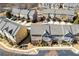 An aerial view showcasing a community of townhomes with ample parking and landscaping at 3898 High Dove Sw Way # 12, Smyrna, GA 30082