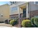 Front entry with brick steps leading to a dark-colored door and interior staircase at 3898 High Dove Sw Way # 12, Smyrna, GA 30082