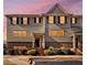 Inviting townhouse exterior with warm sunset lighting and manicured landscaping at 3898 High Dove Sw Way # 12, Smyrna, GA 30082