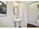 Small powder room with pedestal sink and oval mirror at 3898 High Dove Sw Way # 12, Smyrna, GA 30082