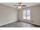 Spacious bedroom featuring a ceiling fan and a large window at 2599 Fieldstone View Se Ln, Conyers, GA 30013