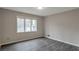 Bright bedroom with large window and wood-look floors at 2599 Fieldstone View Se Ln, Conyers, GA 30013