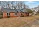 Brick ranch home with landscaped yard and walkway at 2599 Fieldstone View Se Ln, Conyers, GA 30013