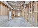 Spacious unfinished basement featuring framed walls, concrete floors, and insulation at 7650 Abbey Glen Dr, Cumming, GA 30028