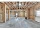 Unfinished basement shows the framework of the walls, door, and window at 7650 Abbey Glen Dr, Cumming, GA 30028
