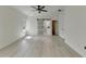 Spacious bedroom with natural light, showcasing the sliding barn door to the bathroom and ceiling fan at 7650 Abbey Glen Dr, Cumming, GA 30028