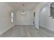 Spacious dining room with hardwood floors and an arched doorway at 7650 Abbey Glen Dr, Cumming, GA 30028