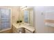 Clean bathroom with a single sink vanity and shower/tub combo at 740 Abbotts Mill Ct, Johns Creek, GA 30097