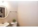 Small half bathroom with a pedestal sink and toilet at 740 Abbotts Mill Ct, Johns Creek, GA 30097